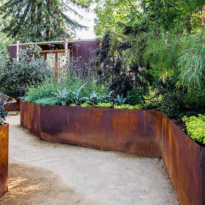 corten steel garden wall retaining plants