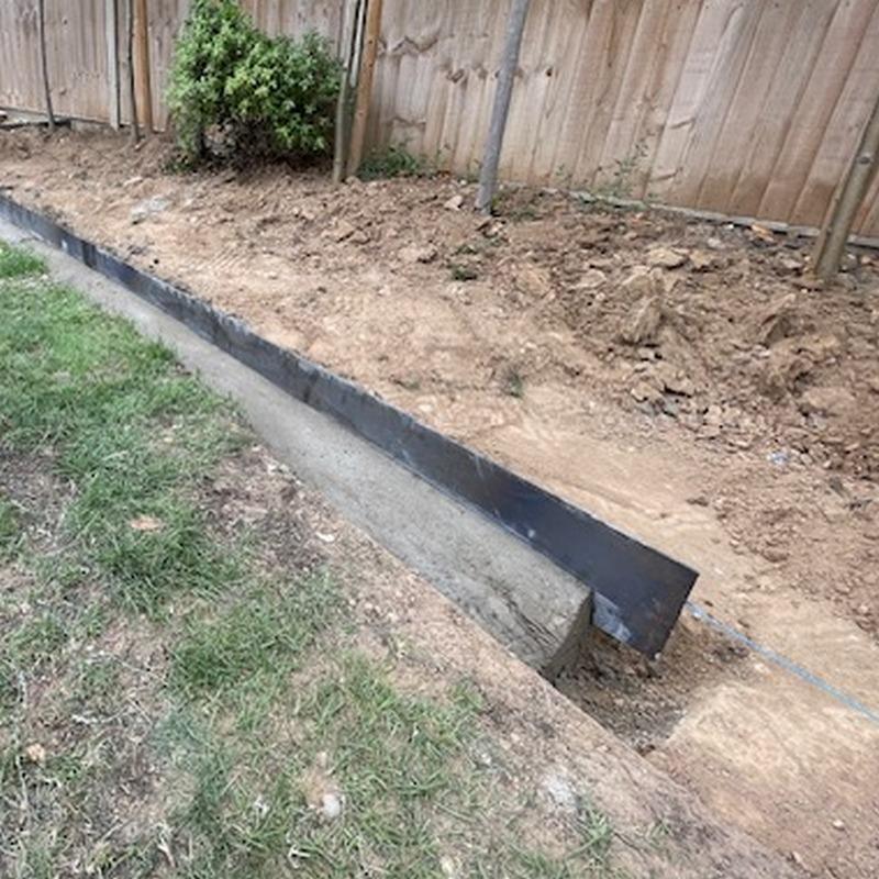 corten edging wth concrete haunching