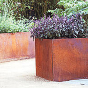 corten garden planter acting as a retaining wall