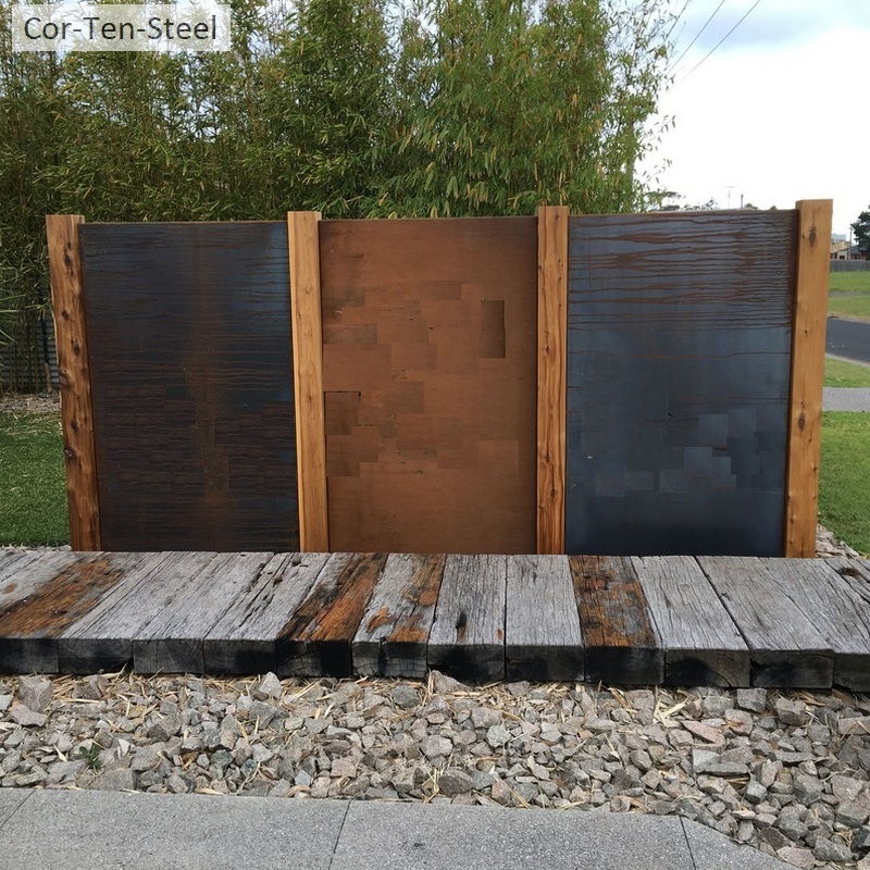 corten panells between timber fence posts