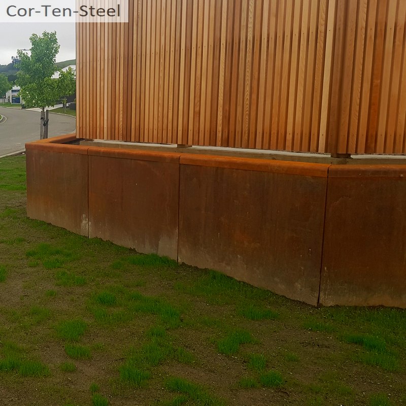 corten retaining wall with fence