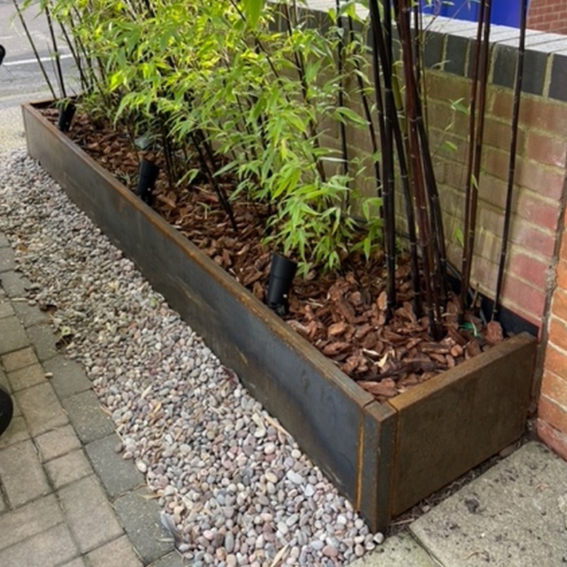 corten planter against brick wall, without back