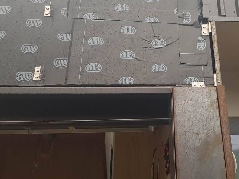 corten rain screen over vaopur barrier on plywood detail